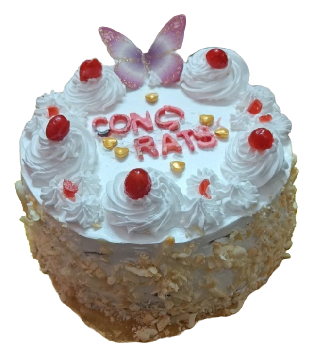 A white-frosted celebration cake with butterfly decorations, red cherries and a piped message.