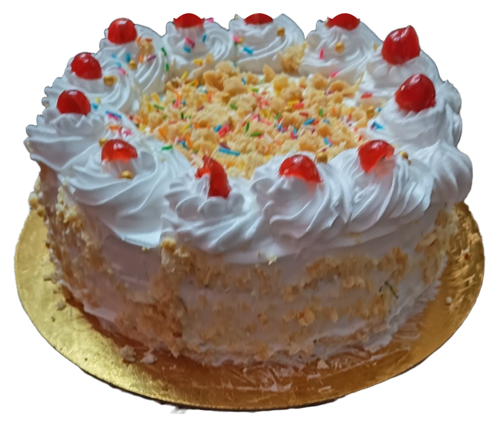 A round cake with white piped swirls, red cherries, colourful sprinkles and textured sides.